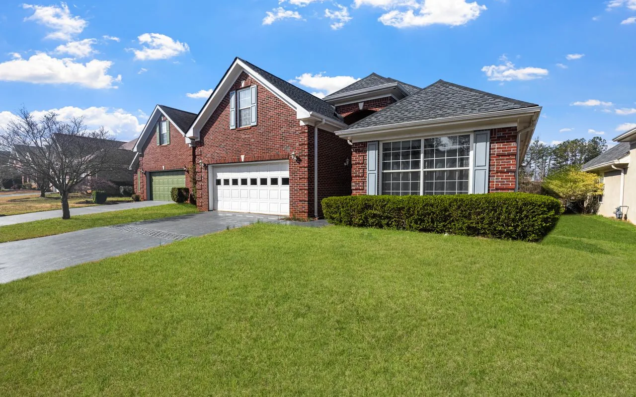 Red brick single-story ranch home in the greater Atlanta area
